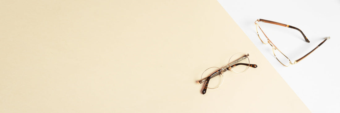 2 pairs of eyeglasses on a pink and white background