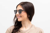 Woman wearing Black Jaguar Sunglasses, Browline Sunglasses with grey polarized lenses - Front view on white background