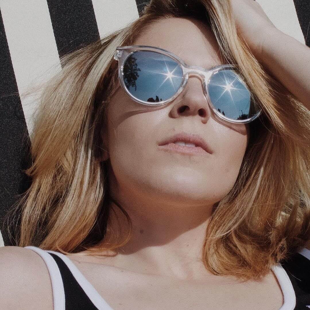 Woman wearing mirror sunglasses