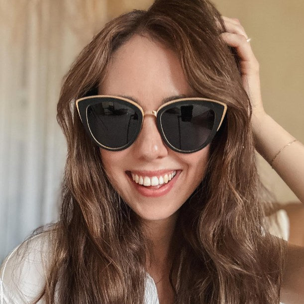 Woman wearing women's sunglasses