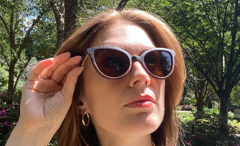 Woman wearing Ivy cat eye sunglasses looking at the sun