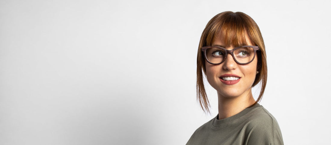 woman wearing Kraywoods square face shape glasses collection on a white background