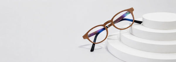 glasses with antireflective lenses sitting on a white surface