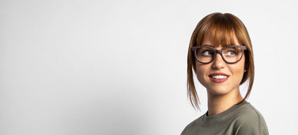 woman wearing Charm Purple, wooden cat eye browline glasses on a white background