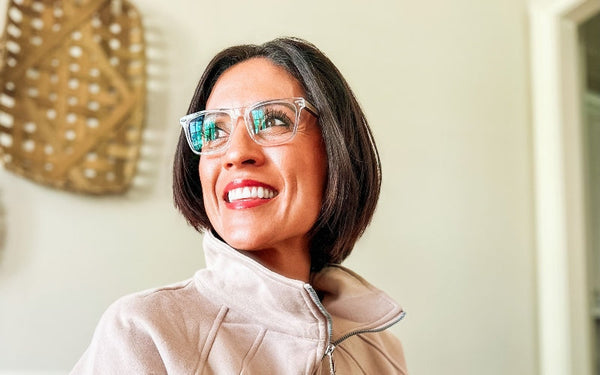 side profile picture of woman wearing blue light glasses