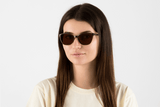 Woman wearing Allure Brown, Cat Eye Brown Acetate Glasses – front view
