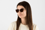 Woman wearing Allure Brown, Cat Eye Brown Acetate Glasses – side view