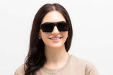 Woman wearing Drift Sunglasses, dark green oversized aviator sunglasses with grey polarized lens