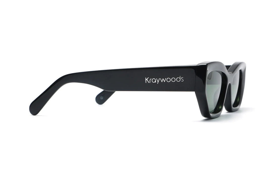 Riley Black Sunglasses, Black rectangular cat-eye sunglasses with green polarized lens - side view on white background