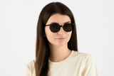 Woman wearing Serene Black, Oval Black Acetate Glasses