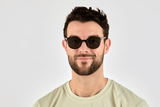 Man wearing Serene Black, Oval Black Acetate Glasses