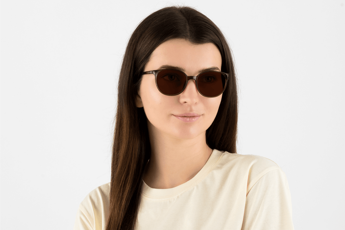 Woman wearing Serene Brown, Oval Brown Acetate Glasses – front view