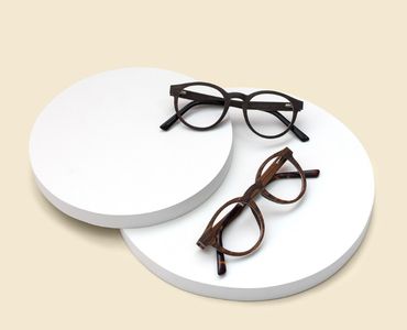 Flatlay of 2 round eyeglasses frames