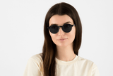 Woman wearing Wonder Navy, Geometric Round Navy Blue Acetate Glasses – front view