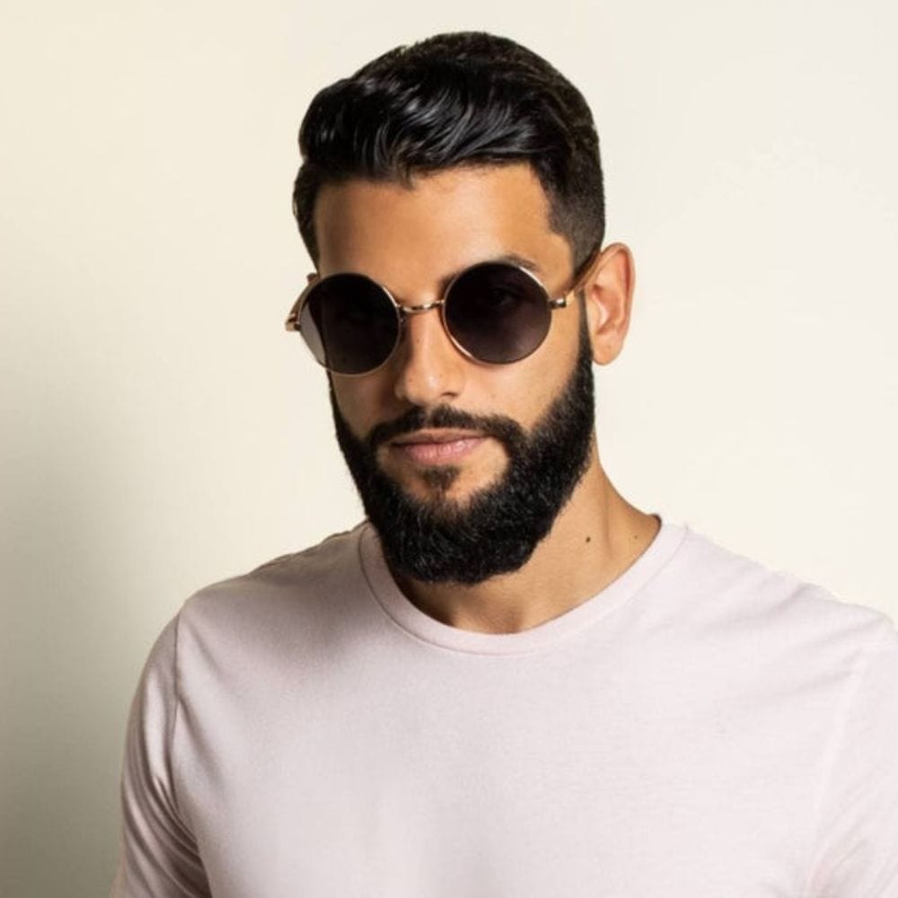 Man wearing round sunglasses