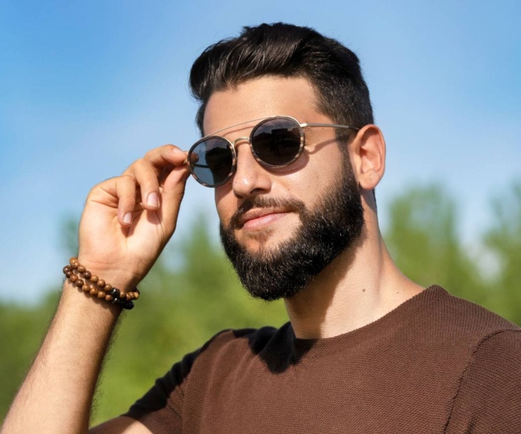 Man wearing Kraywoods Aspen Gold, Gold Round Sunglasses made with Ebony wood and 100% UV Protection, Polarized Lenses