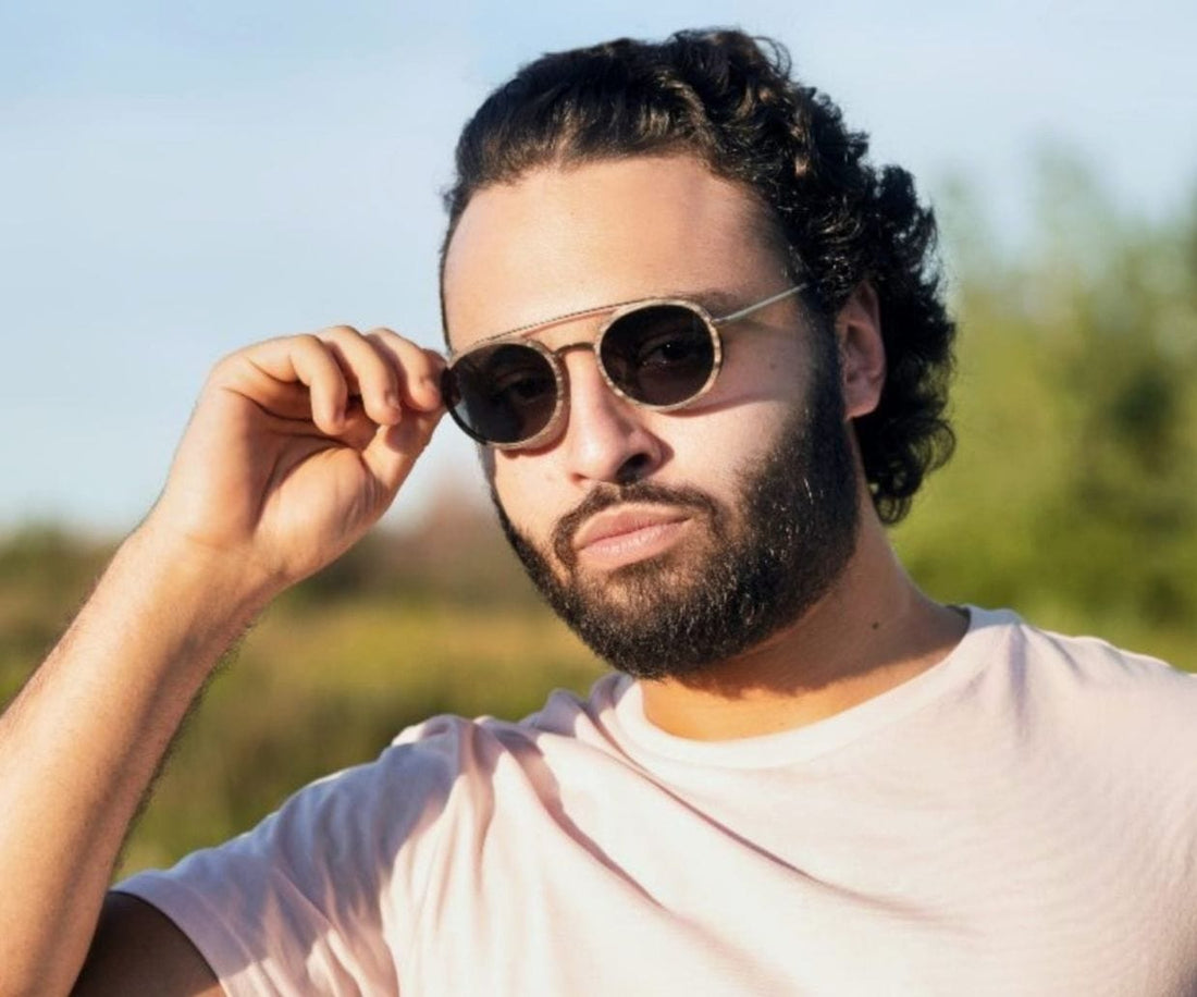 Man Wearing Kraywoods Aspen Silver, Silver Round Sunglasses made with Ebony wood and 100% UV Protection, Polarized Lenses