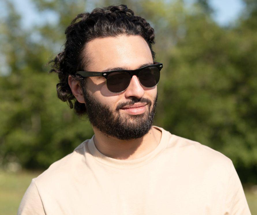 Man wearing Kraywoods Black Jaguar, Browline Sunglasses Featuring Ebony Wood Arms with 100% UV Protection, Polarized Lenses