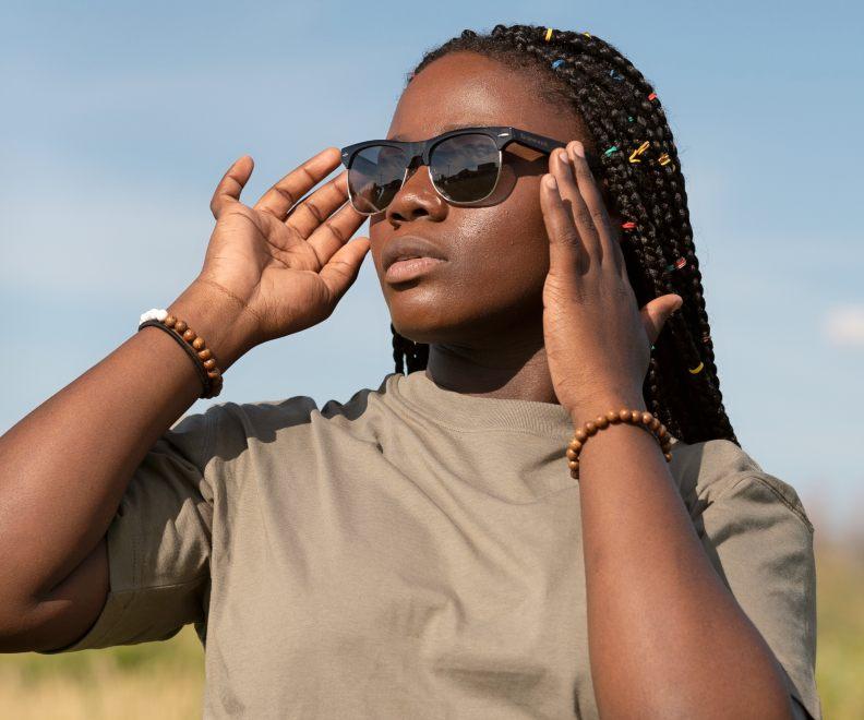 Woman wearing Kraywoods Black Jaguar, Clubmaster Sunglasses Featuring Ebony Wood Arms with 100% UV Protection, Polarized Lenses