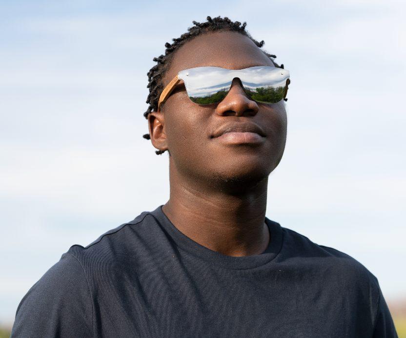 Man wearing Kraywoods Rover, Silver Mirrored reflective Sunglasses featuring Zebra Wood Arms and 100% UV Protection, Polarized Lenses