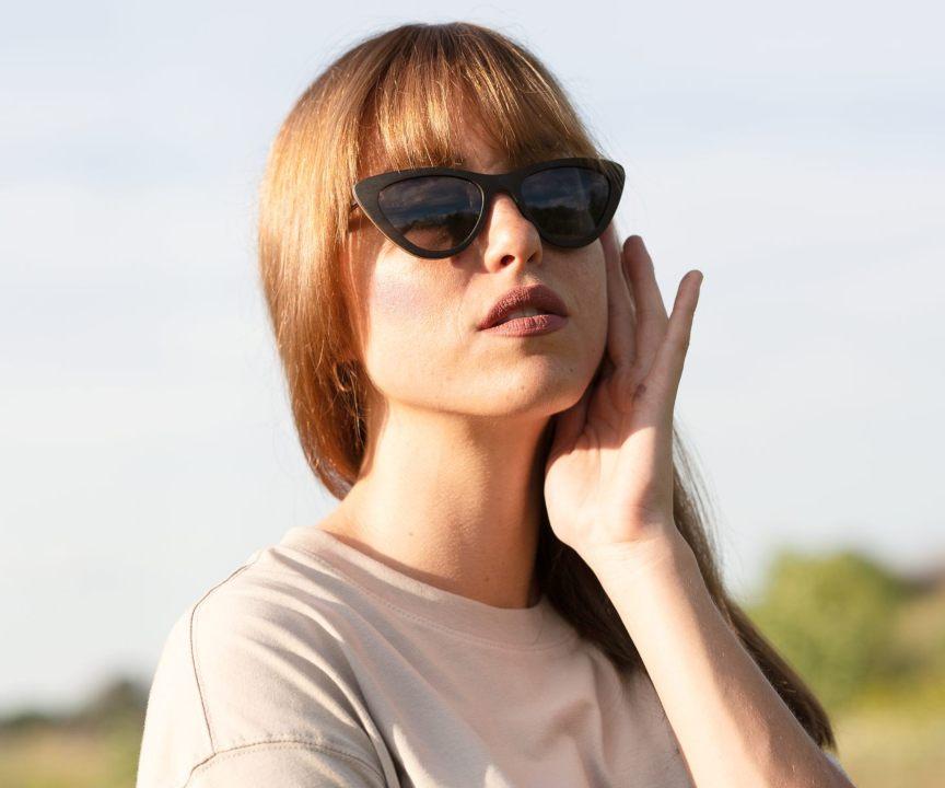 Woman wearing Kraywoods Selena, Small Cat-Eye Sunglasses made from Ebony Wood with 100% UV Polarized Lenses