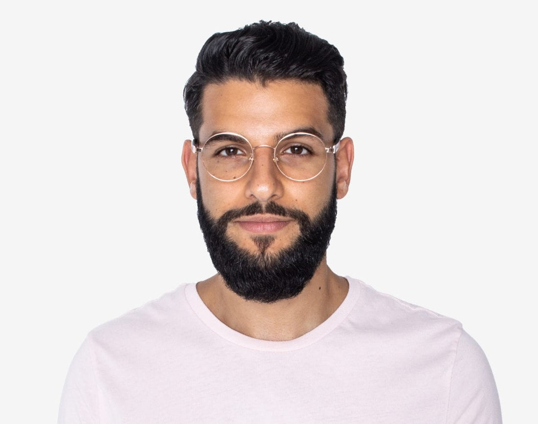 Man wearing Joy Rose Gold - Round Eyeglasses in Rose Gold Metal