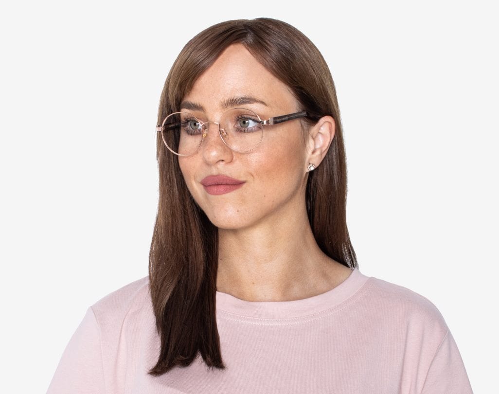 Woman wearing Joy Rose Gold - Round Eyeglasses in Rose Gold Metal