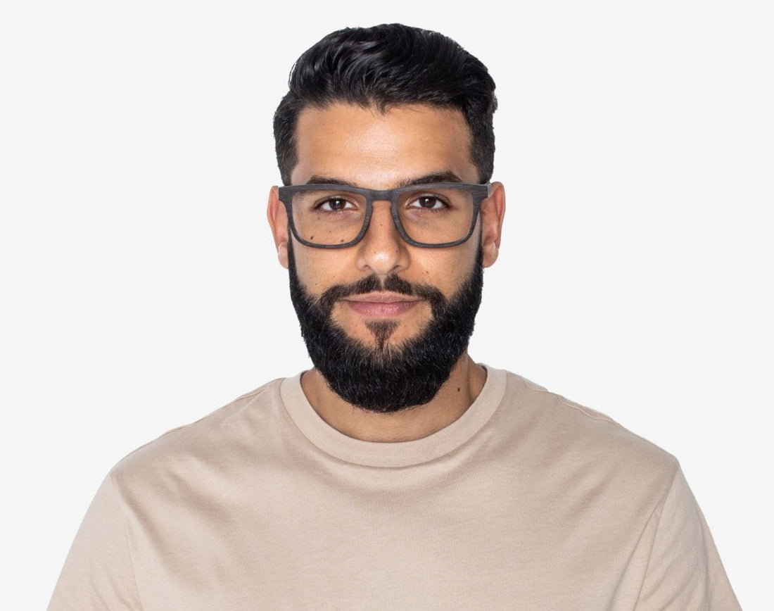 Man wearing Bold Black - Rectangle Eyeglasses made from Oak Wood