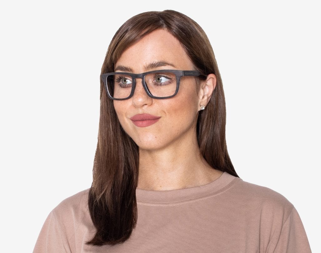 Woman wearing Bold Black - Rectangle Eyeglasses made from Oak Wood