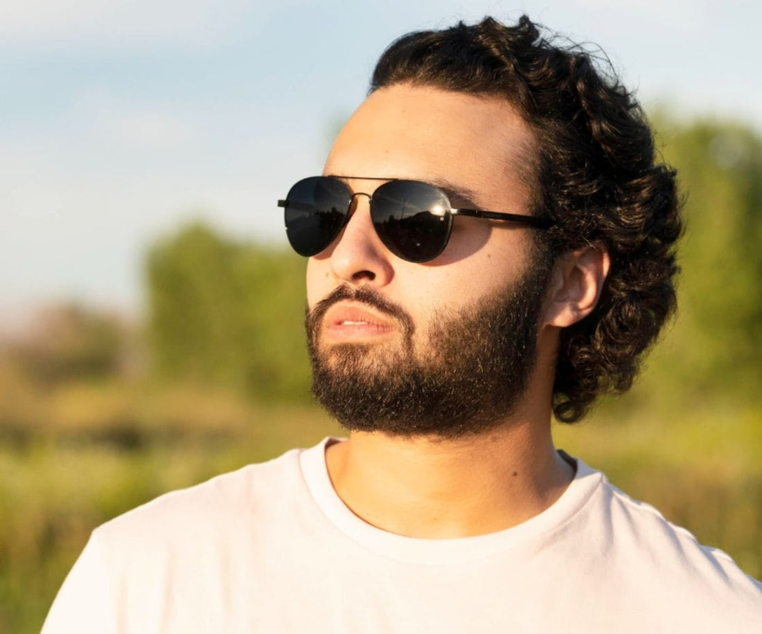 Man wearing Kraywoods Leo, Black Aviator Sunglasses Featuring Ebony wood arms with 100% UV Protection, Polarized Lenses