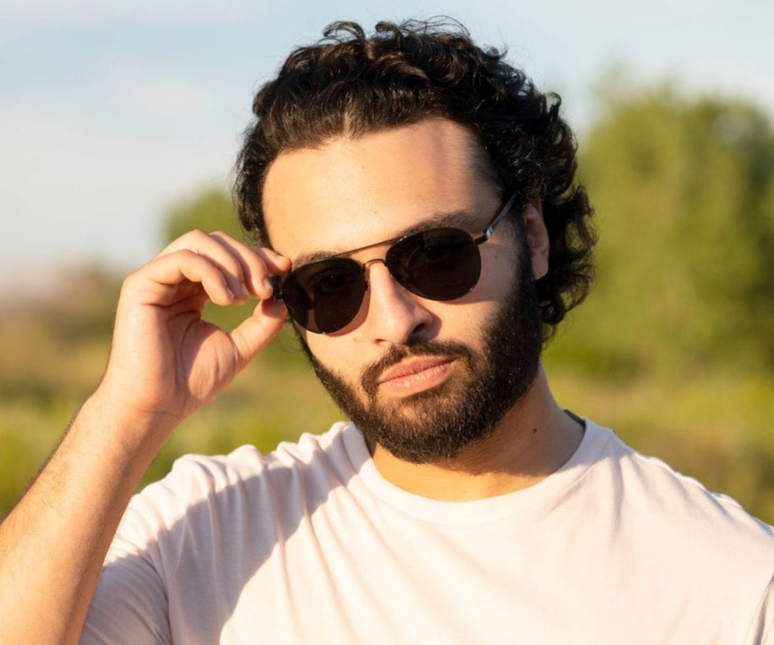 Man wearing Kraywoods Leo, Black Aviator Sunglasses Featuring Ebony wood arms with 100% UV Protection, Polarized Lenses