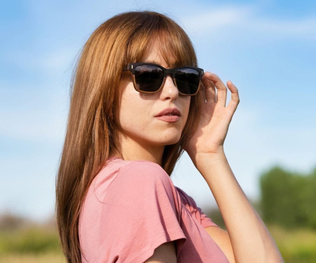 Woman wearing Kraywoods Oxford, Ebony Wood Square Sunglasses Featuring 100% UV Protection, Polarized Lenses