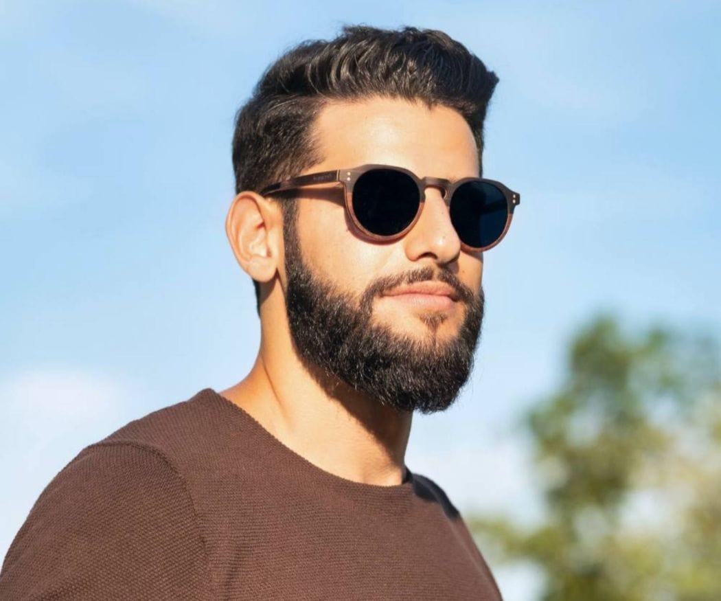 Man wearing Kraywoods Roseland, Round Keyhole Sunglasses made from Ebony and Rose Wood with 100% UV Protection, Polarized Lenses